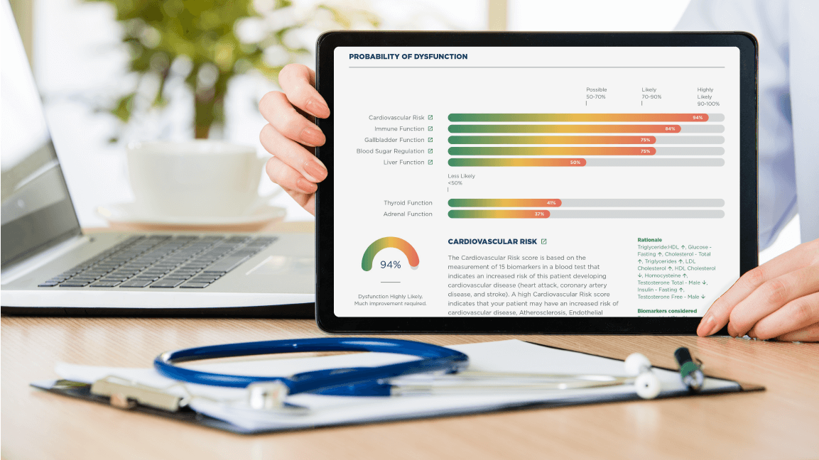 ODX functional blood chemistry report displayed on tablet with laptop and stethoscope on desk
